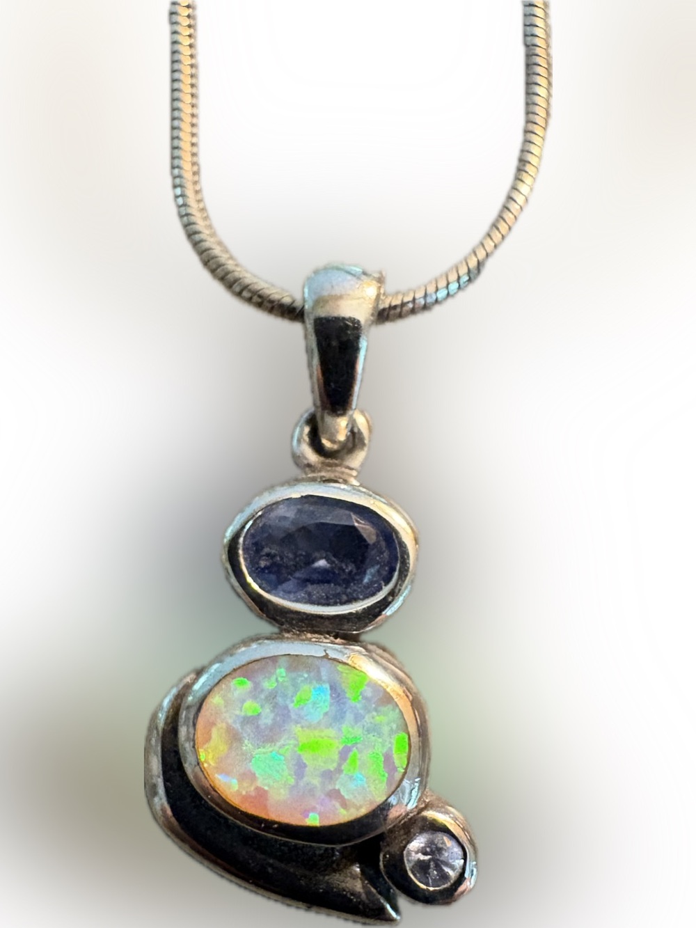 Opal, blue topaz and white topaz/diamond chip in Sterling Silver on chain